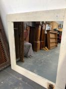 A PAINTED PINE FRAMED MIRROR.