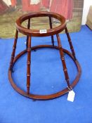 AN 18th C. FRUITWOOD BABY WALKER CRADLE ON CASTER FEET