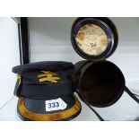 A RAILWAY MANS CAP TOGETHER WITH A CANNISTER