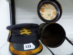 A RAILWAY MANS CAP TOGETHER WITH A CANNISTER