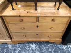 A PINE CHEST OF TWO SHORT AND TWO LONG DRAWERS.