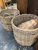 A BIRD HOUSE AND TWO LARGE LOG BASKETS.