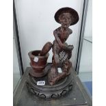 A CARVED WOOD FISHERMAN, A PESTLE AND MORTAR TOGETHER WITH A CHINESE HARD WOOD STAND