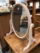 A VICTORIAN SWING MIRROR.