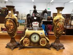 AN EDWARDIAN CLOCK GARNITURE.