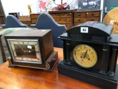 A VICTORIAN BLACK SLATE MANTLE CLOCK AND A ART DECO CLOCK BY GARRARD.