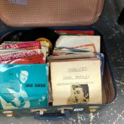 A SMALL SUITCASE CONTAINING VINTAGE RECORDS TO INCLUDE LONG JOHN BALDRY, ELVIS, TED HEATH, KEN DODD,