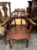 A VICTORIAN SMOKERS BOW ARM CHAIR, AND ONE OTHER SIMILAR.
