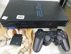TWO SONY PLAY STATION 2 CONSOLES WITH VARIOUS GAMES AND LEADS (ONE MISSING)
