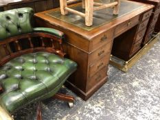 AN EDWARDIN MAHOGANY TWIN PEDESTAL DESK TOGETHER WITH A LEATHER UPHOLSTERED SWIVEL DESK CHAIR.