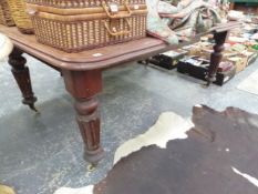 A VICTORIAN MAHOGANY EXTENDING TABLE WITH ONE LEAF.