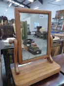 A SMALL VICTORIAN SWING MIRROR.