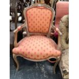 A PAIR OF FRENCH BLEACH WALNUT SALON ARM CHAIRS.