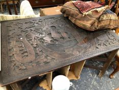 A LARGE ORIENTAL CARVED HARDWOOD PANEL NOW MOUNTED AS A TABLE ON FOLDING STAND.