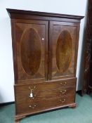 A GEORGIAN MAHOGANY LINEN PRESS WITH HANGING SPACE OVER DRAWERS.