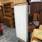 A VINTAGE MEDICAL FOLDING SCREEN.