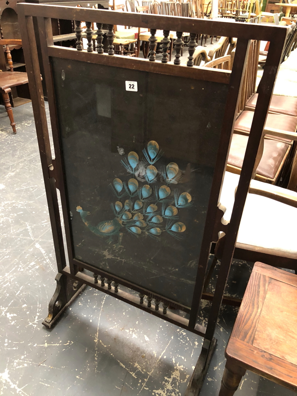 AN EDWARDIAN FIRE SCREEN DECORATED WITH A EXOTIC BIRD.