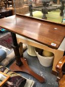 A VICTORIAN MAHOGANY ADJUSTABLE READING STAND.