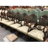 A HARLEQUIN SET OF TWELVE GEORGIAN STYLE MAHOGANY DINING CHAIRS WITH SHIELD BACKS.