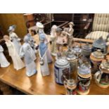 A COLLECTION OF FIGURINES, AND GERMAN BEER STEINS.