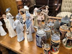 A COLLECTION OF FIGURINES, AND GERMAN BEER STEINS.