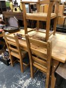 A PINE KITCHEN TABLE AND CHAIRS.