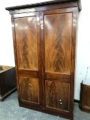 A 19th C. FLAME MAHOGANY TWO DRAWER WARDROBE.