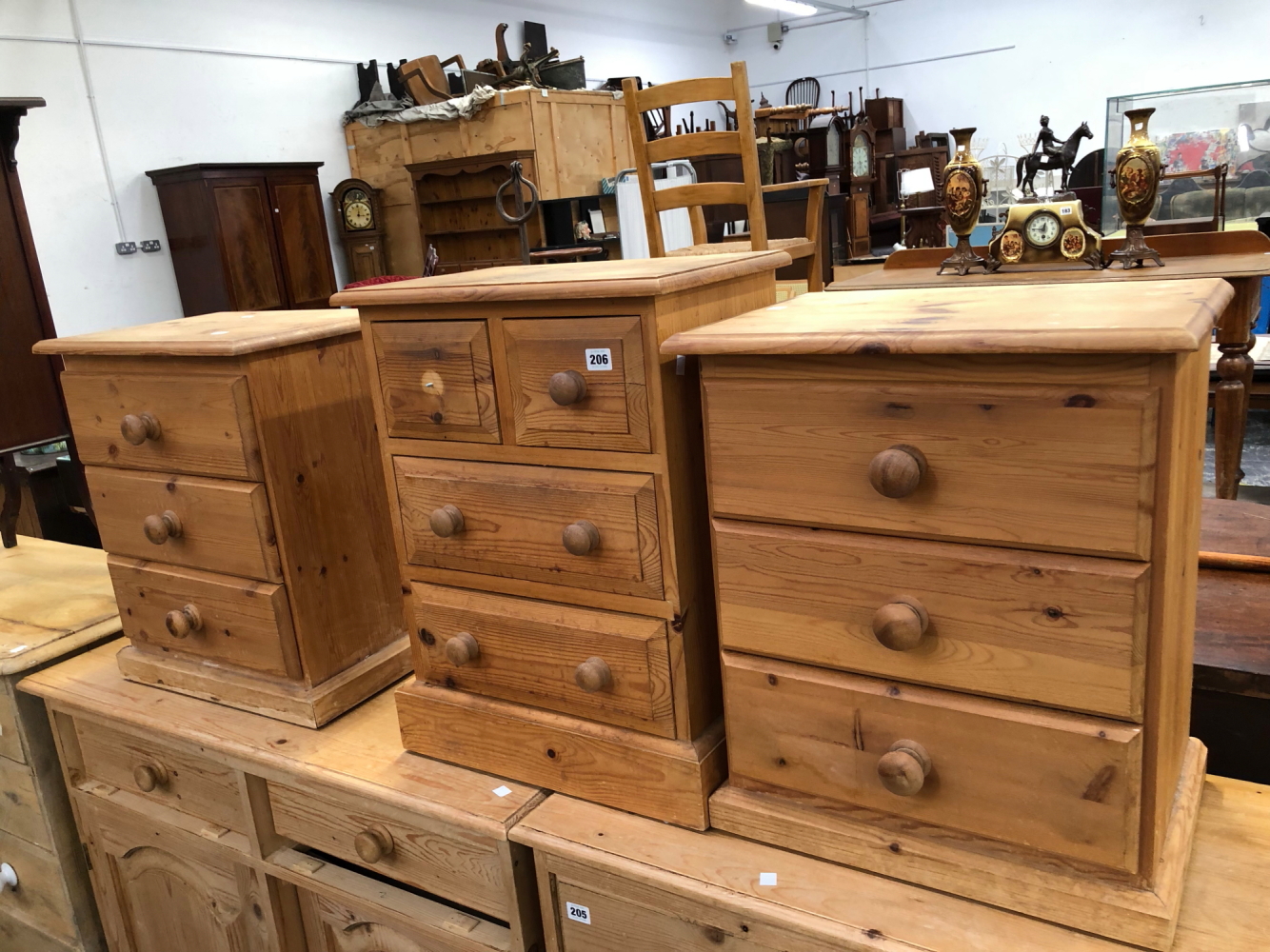 THREE PINE BEDSIDE CHESTS.
