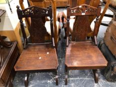 A PAIR OF VICTORIAN OAK HALL CHAIRS.