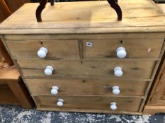 A VICTORIAN PINE CHEST OF DRAWERS.