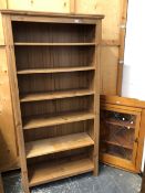 A PINE OPEN BOOKCASE AND A CORNER CABINET.