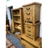 A GOOD QUALITY OAK OPEN BOOK CASE, A PAIR OF THREE DRAWER END TABLES, AND A TV TABLE.