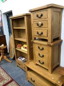 A GOOD QUALITY OAK OPEN BOOK CASE, A PAIR OF THREE DRAWER END TABLES, AND A TV TABLE.