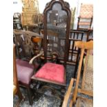 AN EARLY 17th CENTURY STYLE HIGH BACK SIDE CHAIR WITH CARVED AND TURNED STRETCHERS.