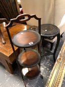 A FOLDING CAKE STAND, A LARGE EASTERN BRASS TRAY AND AN ORIENTAL POT STAND.