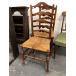 A PAIR OF ARTS AND CRAFTS STYLE, RUSH SEAT LADDER BACK CHAIRS.