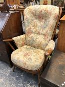 AN ERCOL COTTAGE ARM CHAIR.