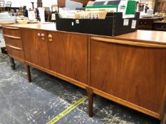 A RETRO TEAK SIDE BOARD.