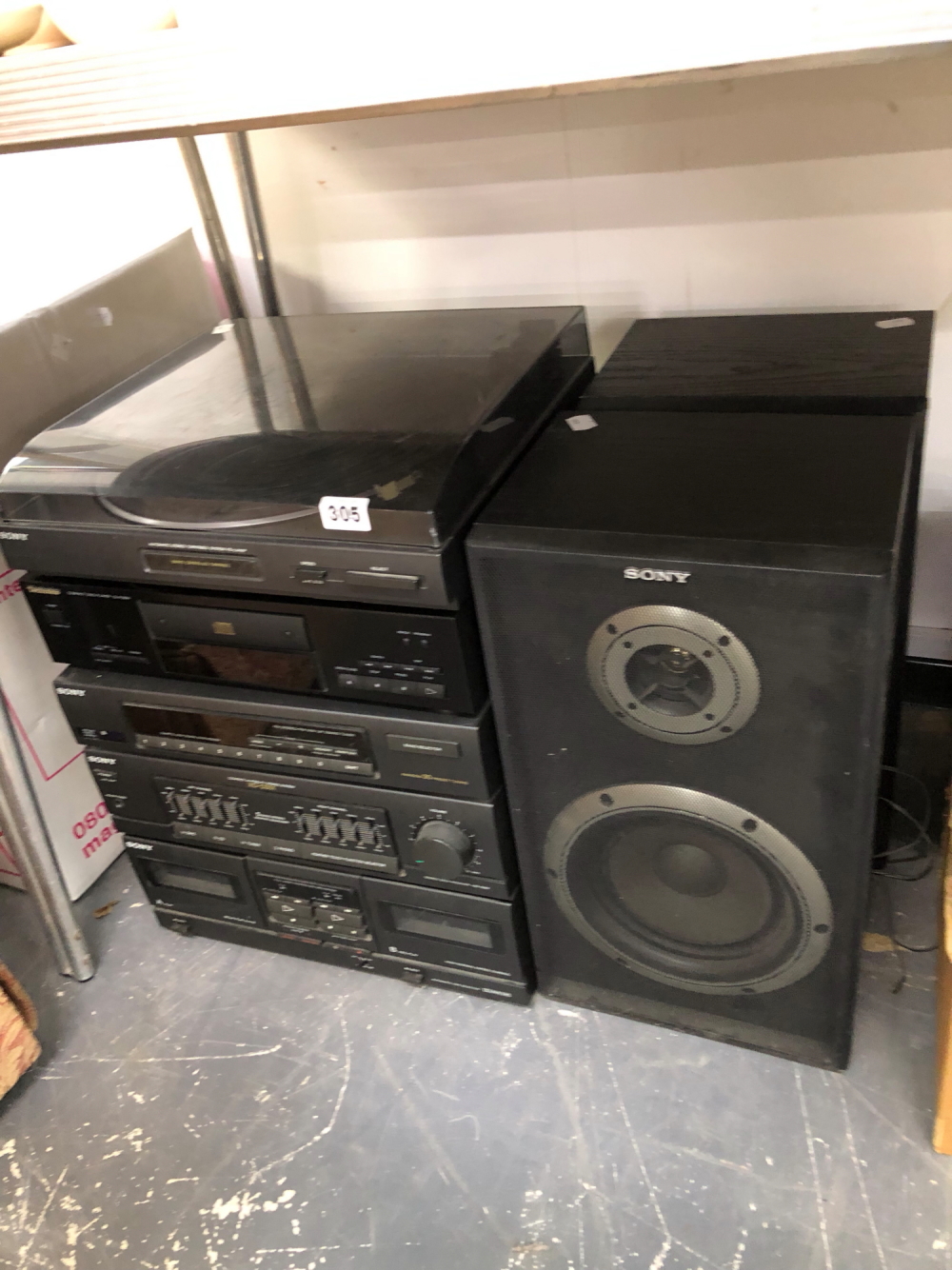 A SONY STEREO STACKING SYSTEM AND A TECHNICS CD PLAYER.