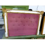 A DOUBLE BED HEAD, THE PINK BUTTONED UPHOLSTERY FRAMED IN WHITE WITH GILT FOLIATE CORNERS. 112 x