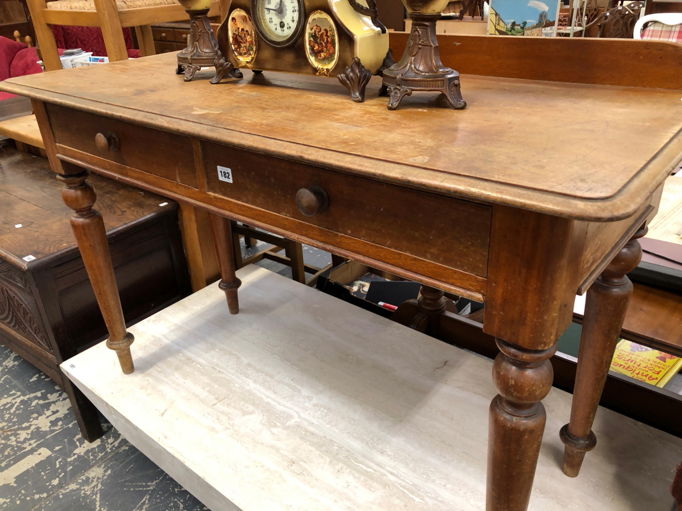 A VICTORIAN MAHOGANY TWO DRAWER SIDE TABLE.