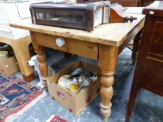 A PINE TABLE, THE RECTANGULAR TOP ABOVE TWO END DRAWERS, THE BALUSTER LEGS ON SPINDLE FEET. W 138