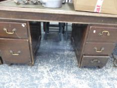 A 20th C. OAK PEDESTAL DESK, THE LEATHERETTE INSET TOP ABOVE TWO BANKS OF THREE DRAWERS. W 137 x D