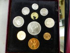CASED COIN SETS, LOOSE GB AND WORLD COINAGE, AND A COIN COLLECTORS ALBUM WITH PART CONTENTS.