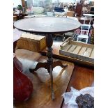 A GEORGE III MAHOGANY TRIPOD TABLE WITH DISHED TOP AND TURNED COLUMN. Dia. 54 x H 68cms.