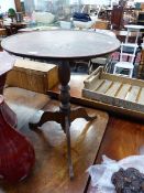 A GEORGE III MAHOGANY TRIPOD TABLE WITH DISHED TOP AND TURNED COLUMN. Dia. 54 x H 68cms.