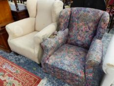 TWO WING ARMCHAIRS, ONE UPHOLSTERED IN FLORAL MATERIAL THE OTHER IN BEIGE