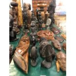 A COLLECTION OF AFRICAN AND FAR EASTERN CARVED FIGURES.