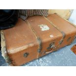 A BROWN LEATHERETTE COVERED CABIN TRUNK