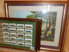 TWO FRAMED GROUPS OF CIGARETTE CARDS OF STEAM ENGINES, TOGETHER WITH A LANDSCAPE PRINT